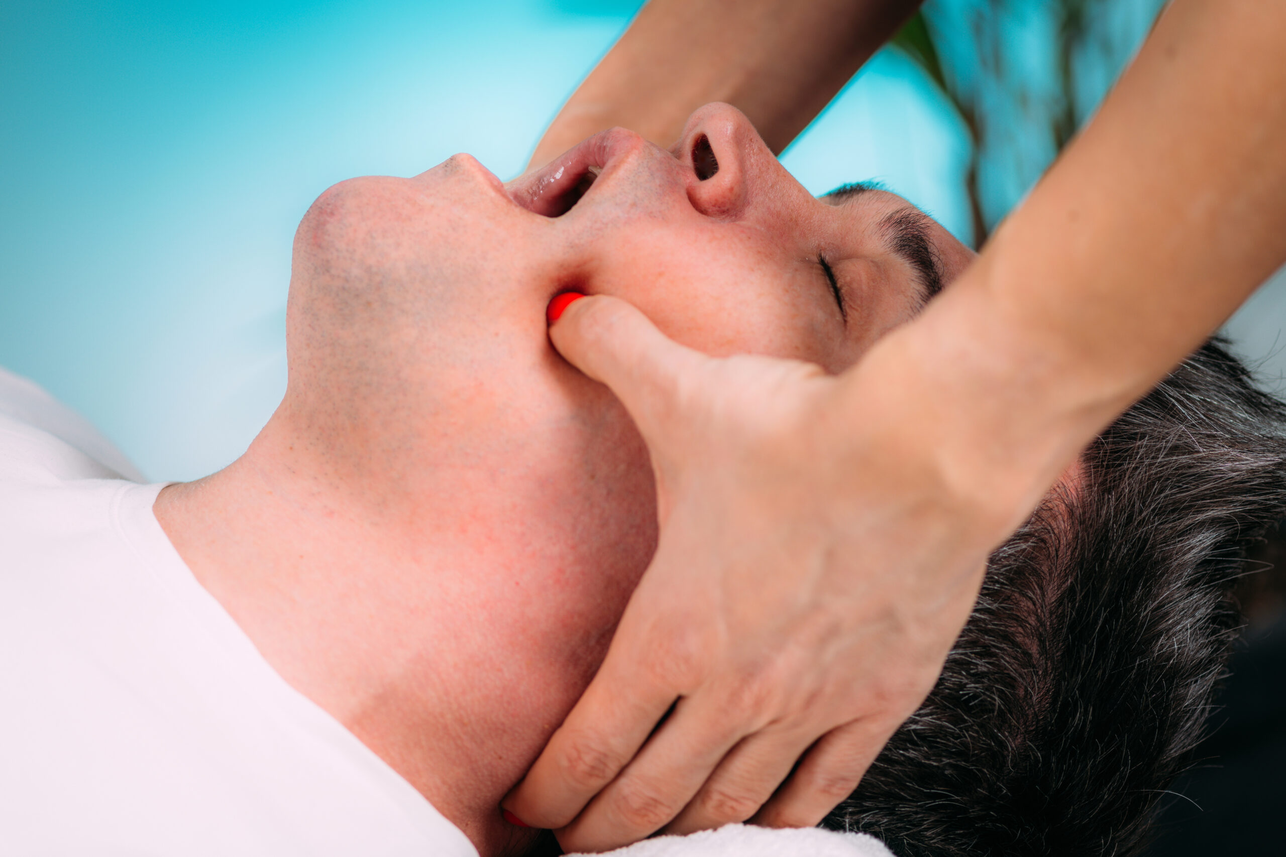 jaw massage therapist doing realignment massage 2023 11 27 05 00 38 utc scaled